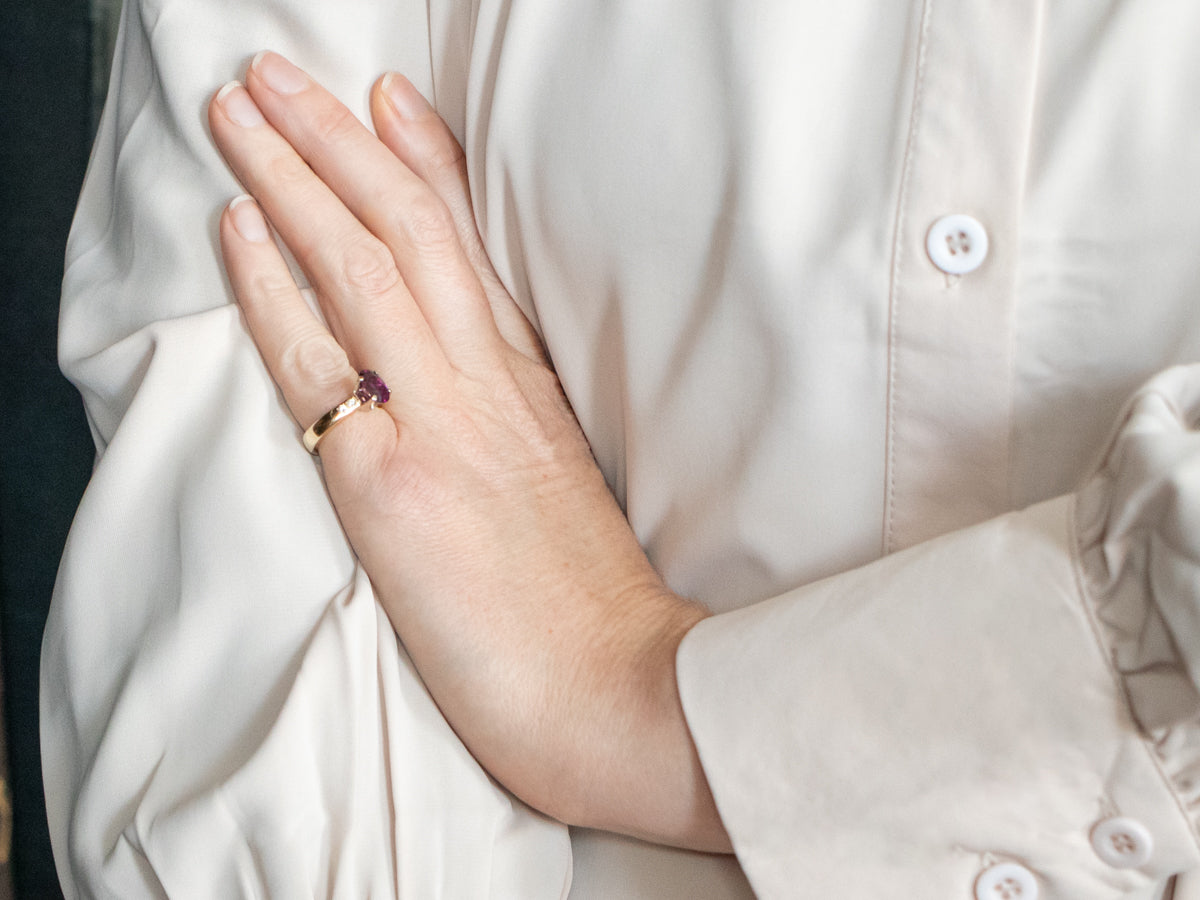 Yellow and White Gold Oval Cut Rhodolite Garnet Ring with Diamond Accents