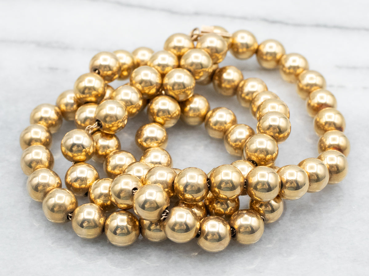 Polished Gold Beaded Necklace with Barrel Clasp