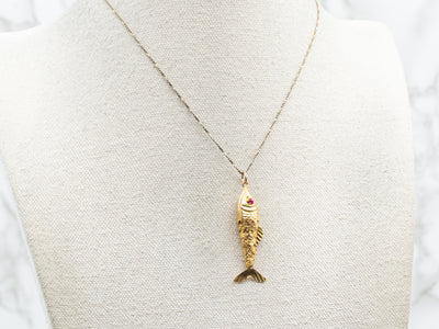 Yellow Gold Moving Fish Pendant with Synthetic Ruby Eyes