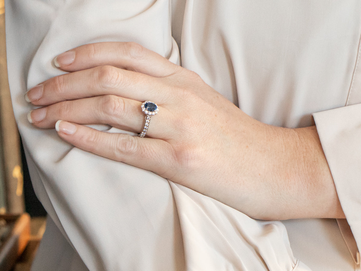 Modern Oval Cut Sapphire Halo Engagement Ring