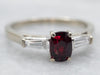 White Gold Oval Cut Ruby Ring with Baguette Cut Diamond Accents