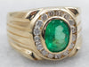 Yellow Gold Bezel Set Oval Cut Emerald Ring with Diamond Halo and Grooved Shoulders
