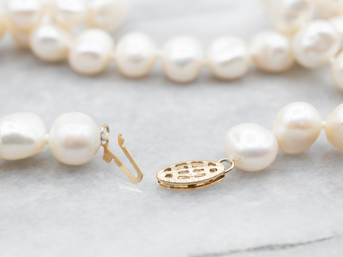 Collar de perlas de agua dulce en oro amarillo
