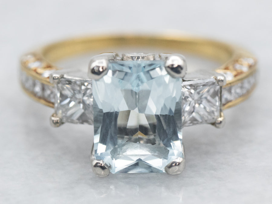 Mixed Metal Yellow Gold and Platinum Emerald Cut Blue Topaz Ring with Diamond Accents