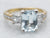 Mixed Metal Yellow Gold and Platinum Emerald Cut Blue Topaz Ring with Diamond Accents