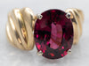 Yellow Gold Oval Cut Rhodolite Garnet Solitaire Ring with Twist Shoulders