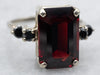 White Gold Emerald Cut Garnet Ring with Black Diamond Accents