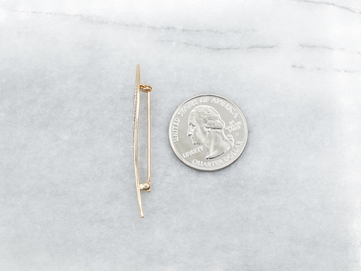 Broche en forma de remolino de diamantes en oro amarillo