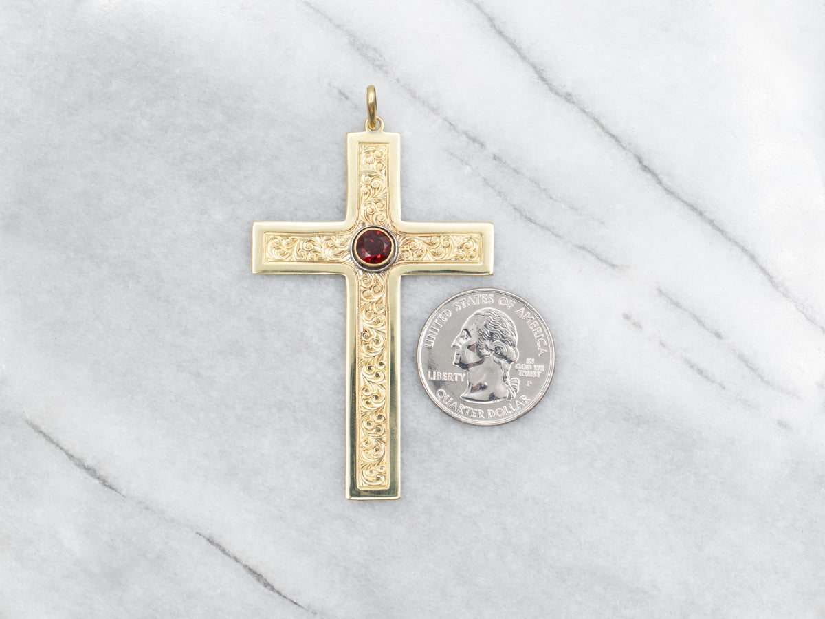 Cruz llamativa adornada de oro y granate