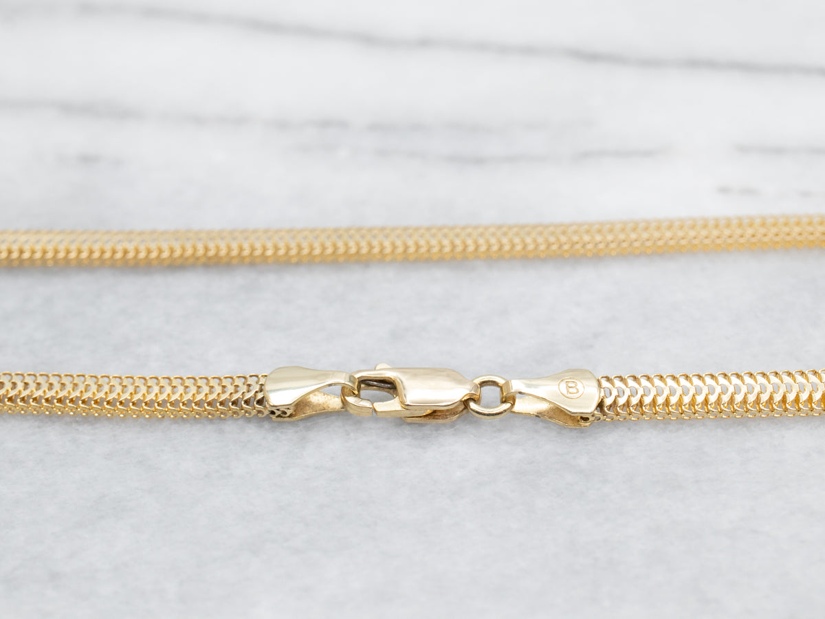 Collar de cadena ancha tejida en oro