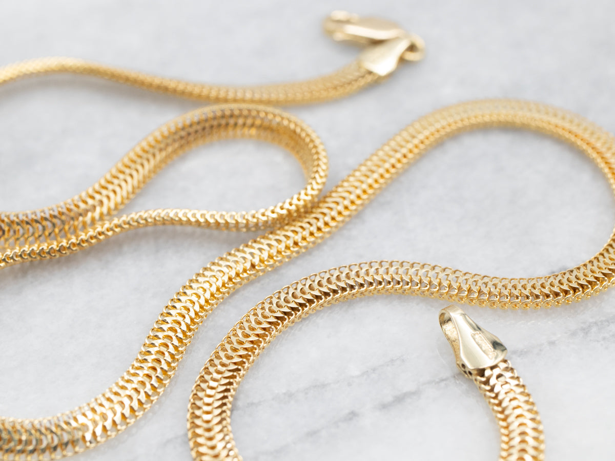 Collar de cadena ancha tejida en oro