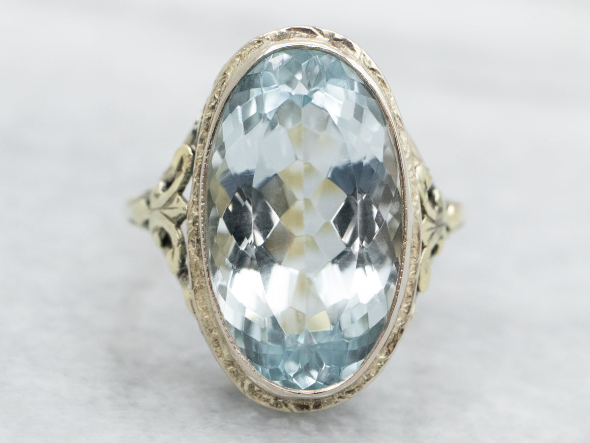 Two Tone Green and White Gold Oval Cut Blue Topaz Solitaire Ring