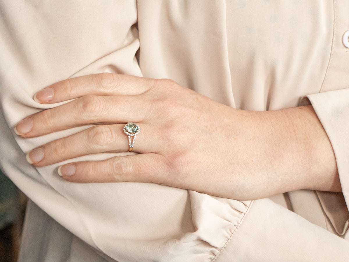 Yellow Gold Oval Cut Blue Zircon Split Shank Ring With Diamond Halo and Diamond Shoulders