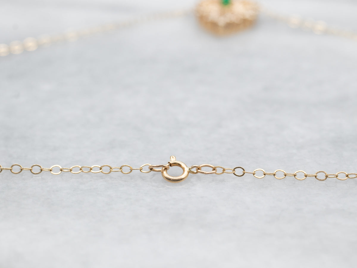 Gold Emerald and Diamond Halo Heart Shaped Necklace