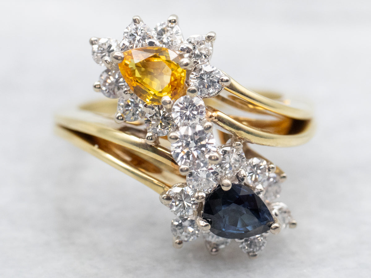 Blue and Yellow Sapphire Bypass Ring with Diamond Halos