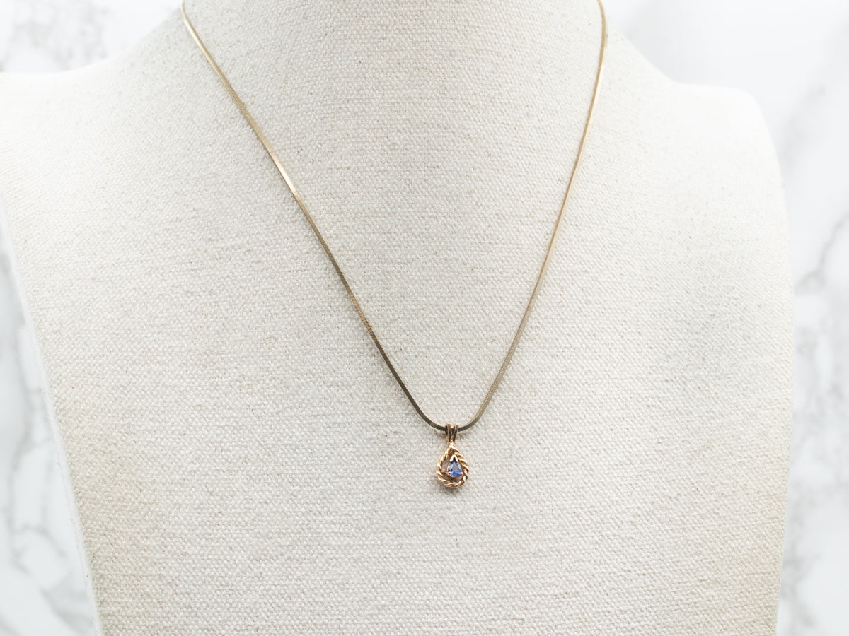 Colgante con solitario de zafiro y oro en forma de lágrima