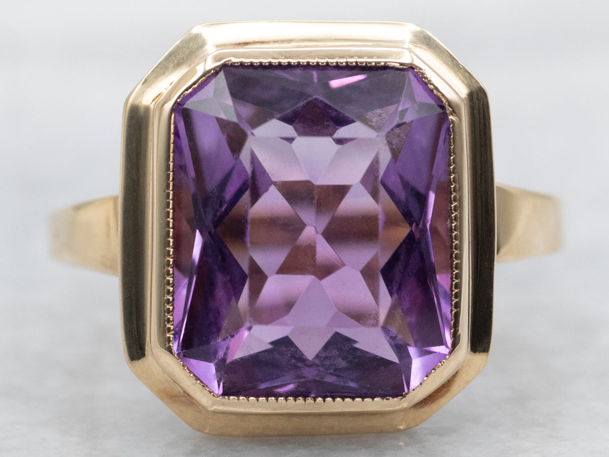 Yellow Gold Bezel Set Emerald Cut Amethyst Solitaire Ring