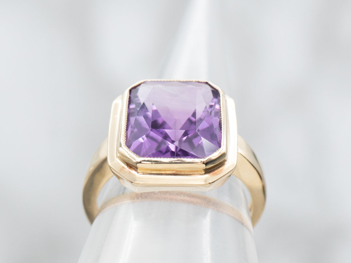 Yellow Gold Bezel Set Emerald Cut Amethyst Solitaire Ring