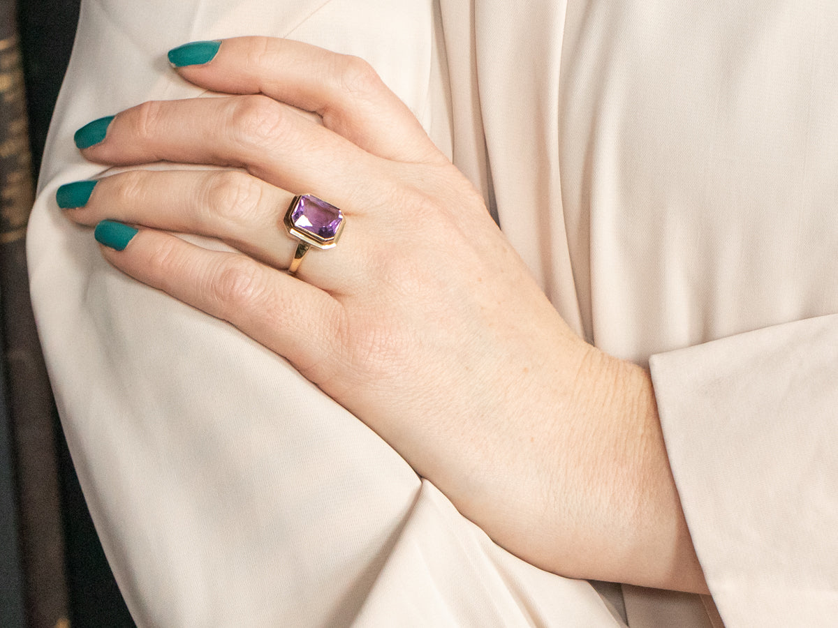 Yellow Gold Bezel Set Emerald Cut Amethyst Solitaire Ring