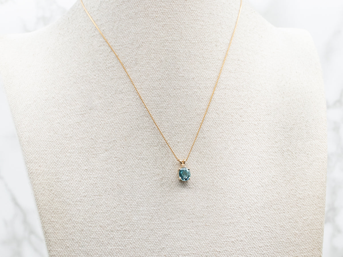 Yellow Gold Blue Zircon Pendant with Diamond Accent
