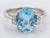 White Gold Blue Topaz Ring with Diamond Accents