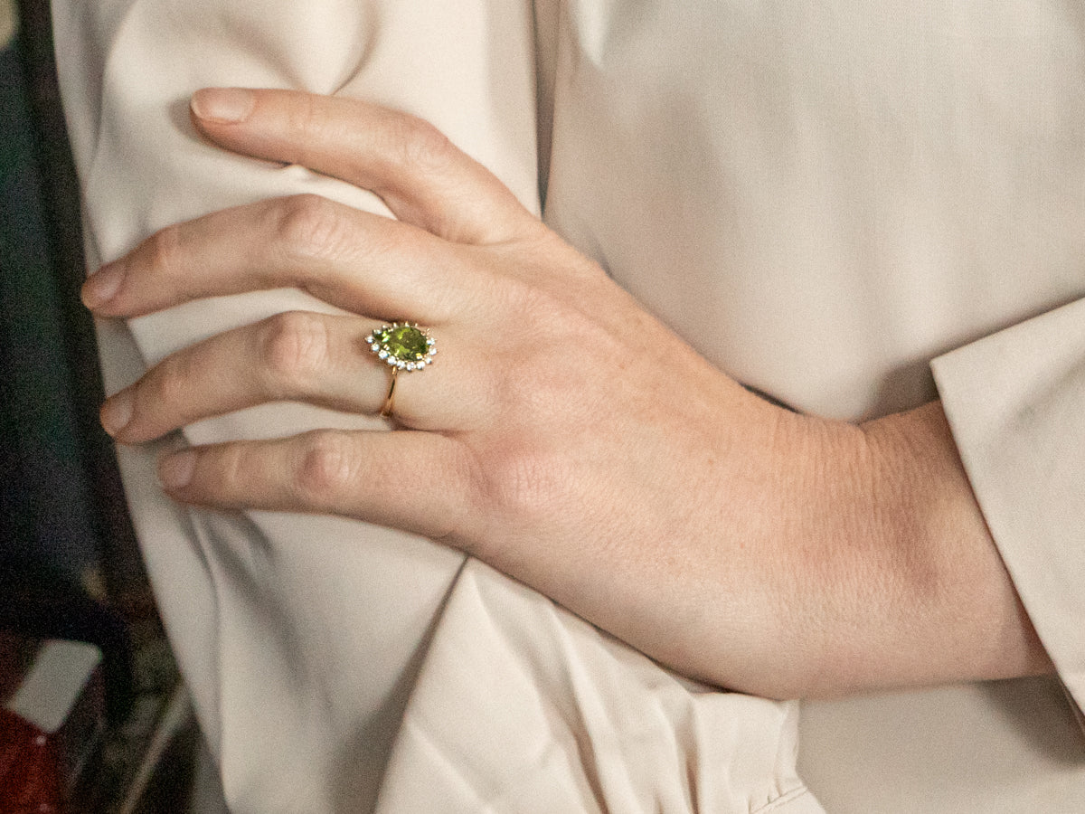 Modern Peridot Ring with Diamond Halo