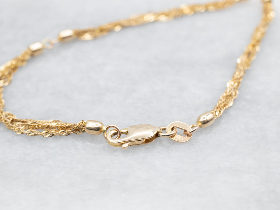 Yellow Gold Four Strand Bracelet with Lobster Clasp