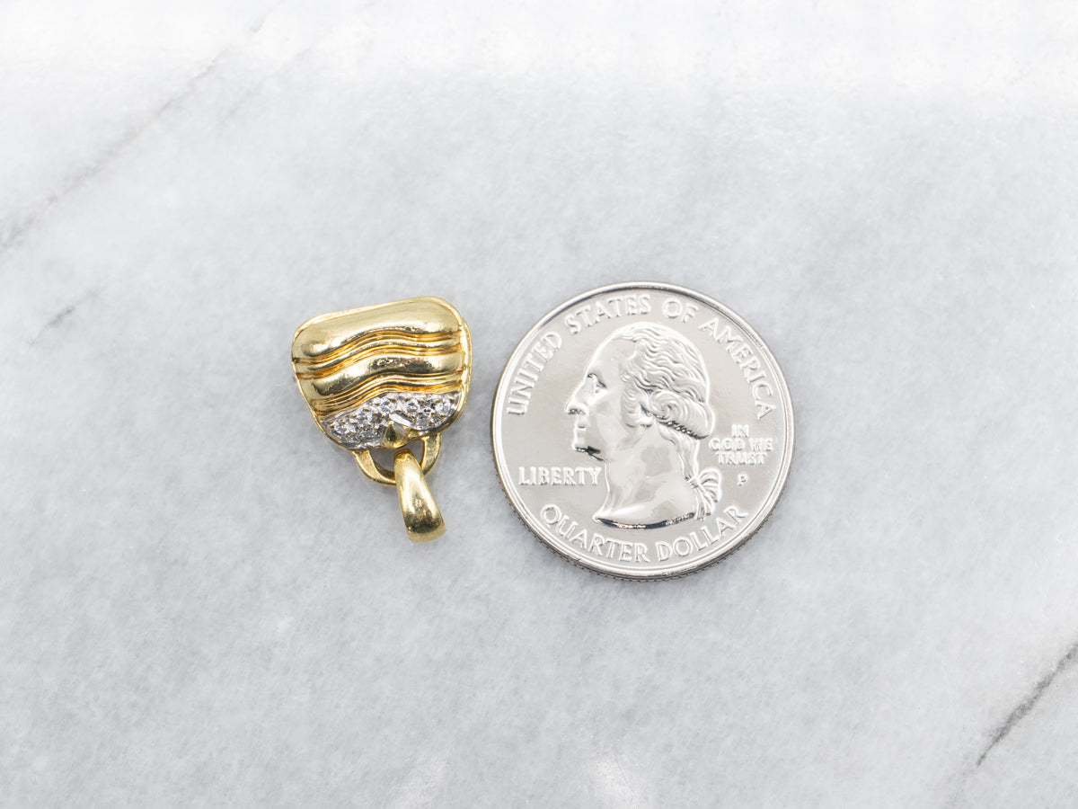 Charm para bolso con apertura de diamantes en oro amarillo