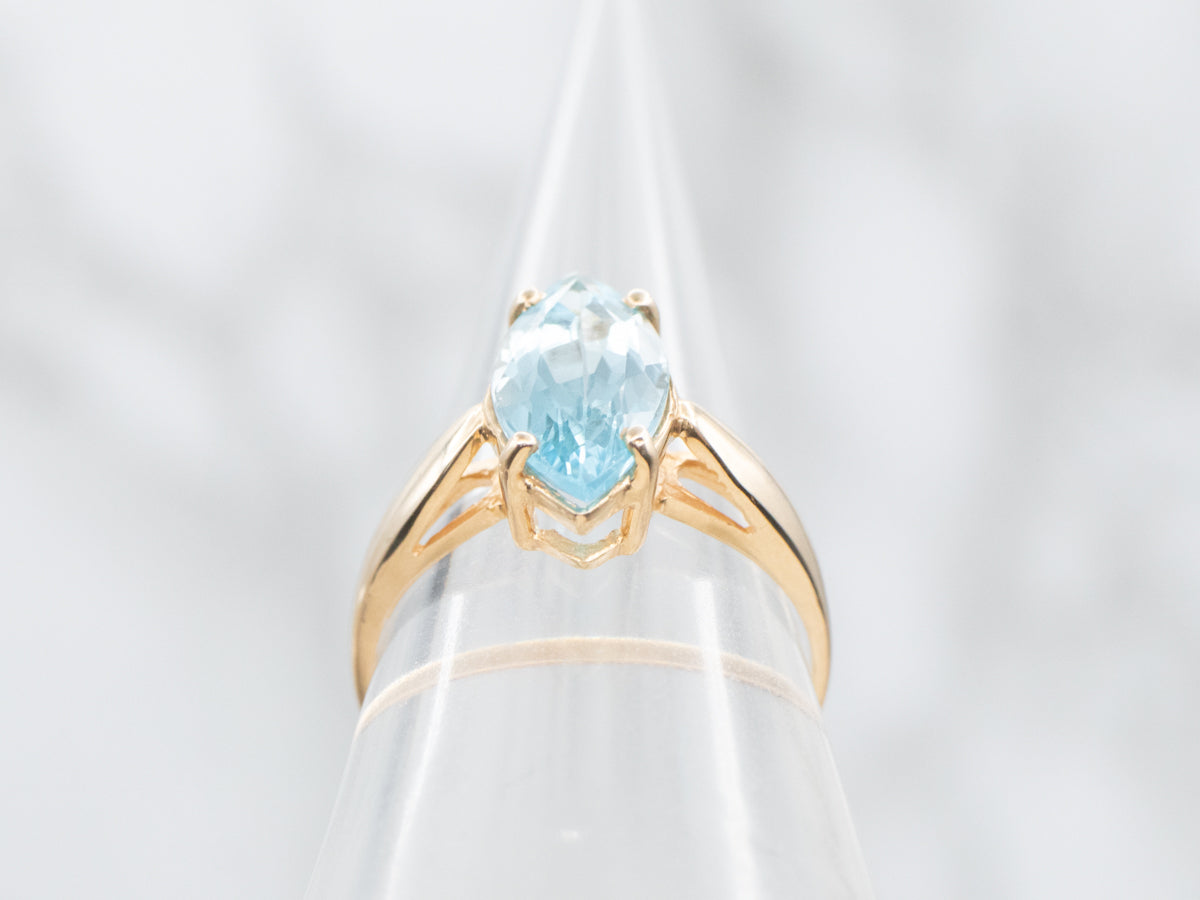 Marquise Blue Topaz Solitaire Ring in Yellow Gold Setting
