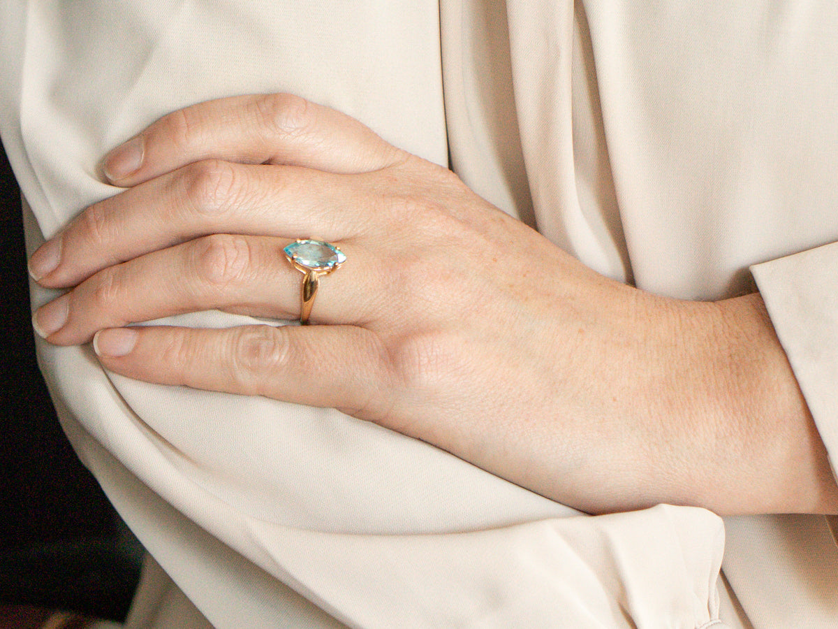 Marquise Blue Topaz Solitaire Ring in Yellow Gold Setting