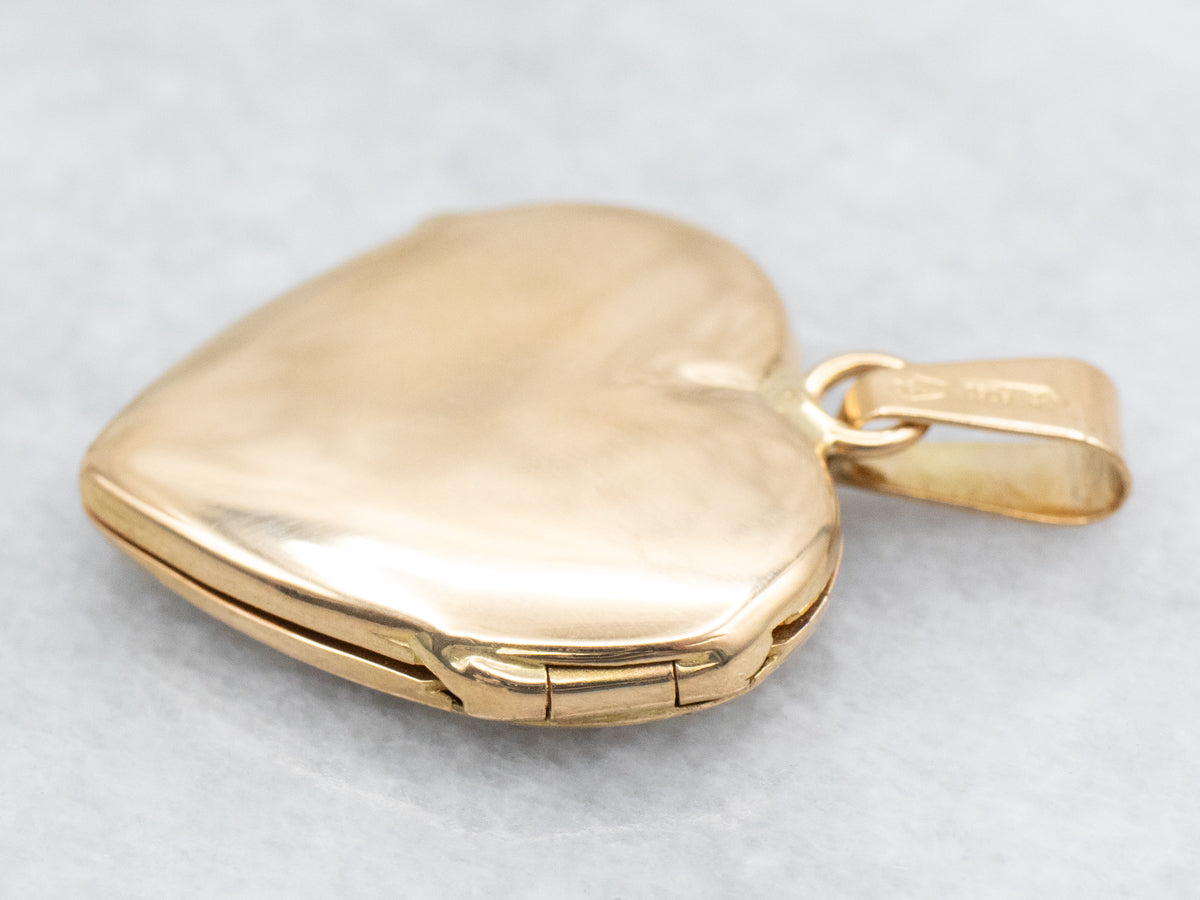 Medallón de corazón de oro grabado vintage