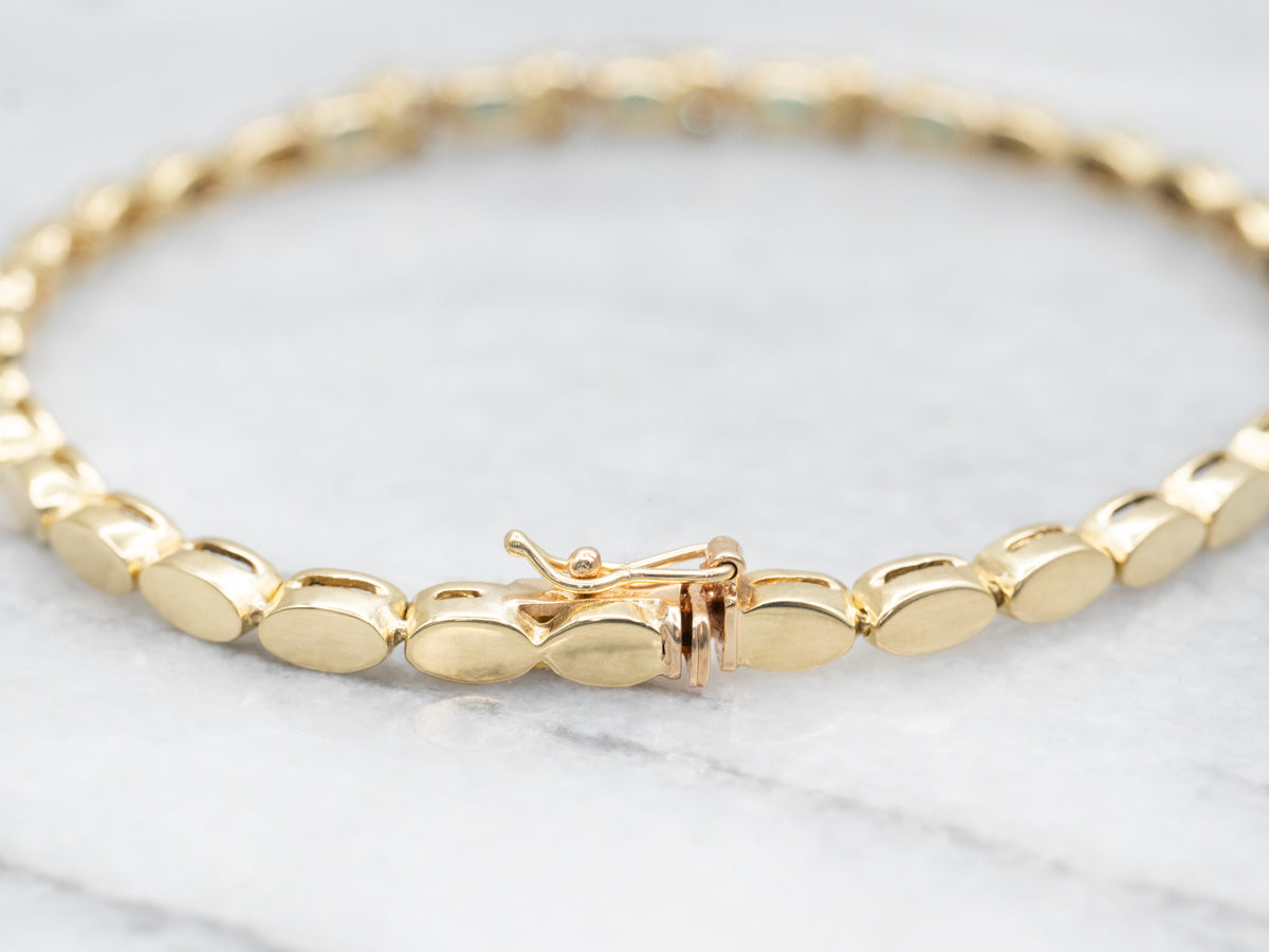 Pulsera de oro amarillo con zafiros y diamantes