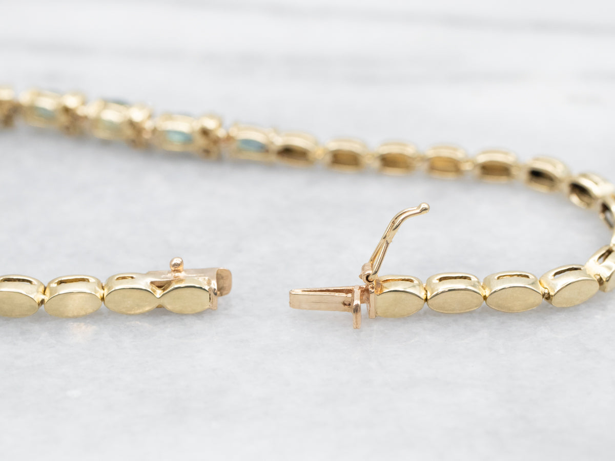 Pulsera de oro amarillo con zafiros y diamantes