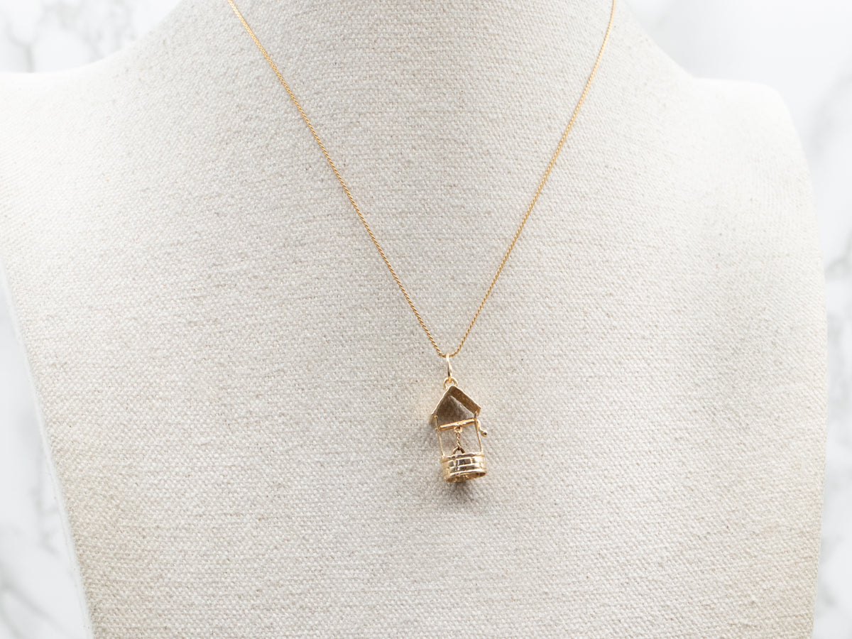 Dije de pozo de los deseos de oro