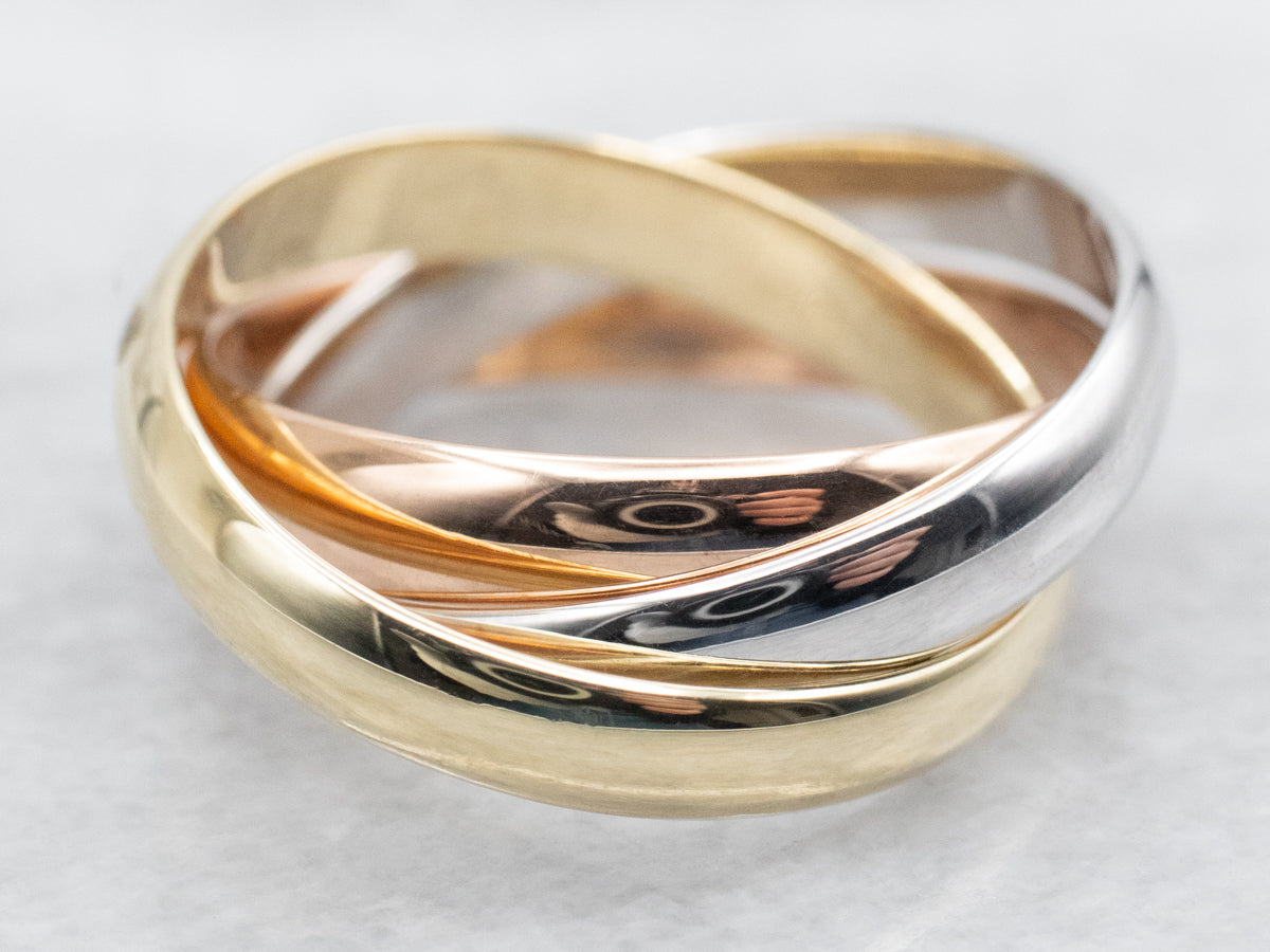 Bandas entrelazadas de tres colores.