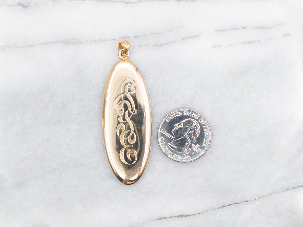 Gold "ATE" Engraved Elongated Oval Locket