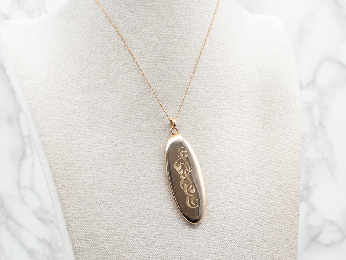 Gold "ATE" Engraved Elongated Oval Locket