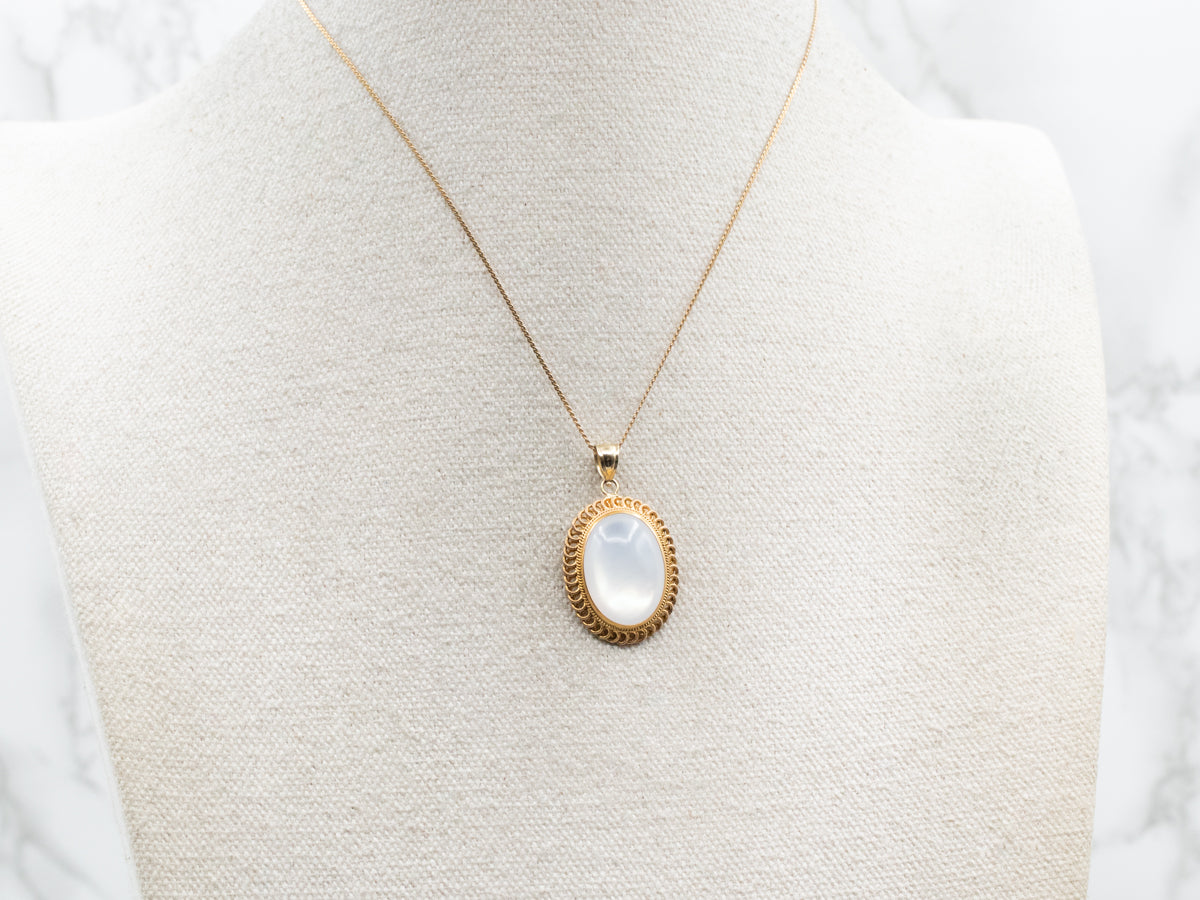 Mother of Pearl Pendant in Looping Gold Frame