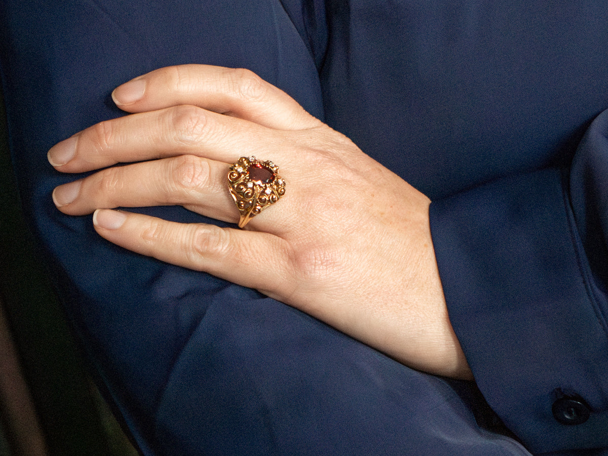 Ornate Gold and Garnet and Diamond Scrolling Halo Ring