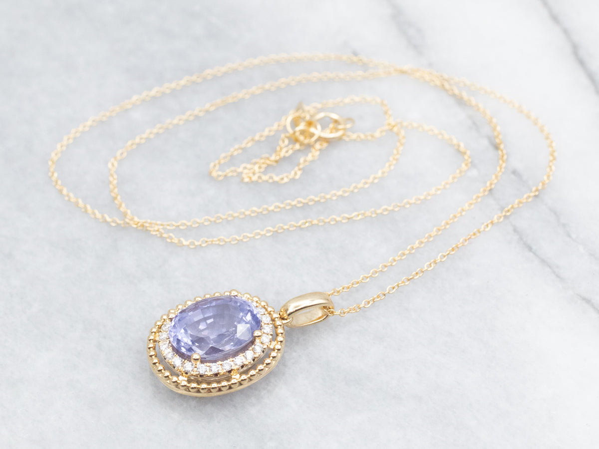 Modern Gold Sapphire Halo Pendant Necklace