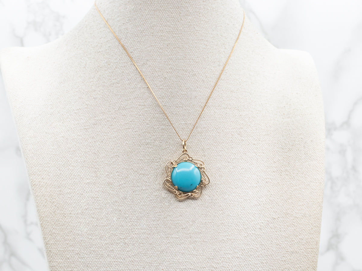 Turquoise and Gold Pendant in Scrolling Frame