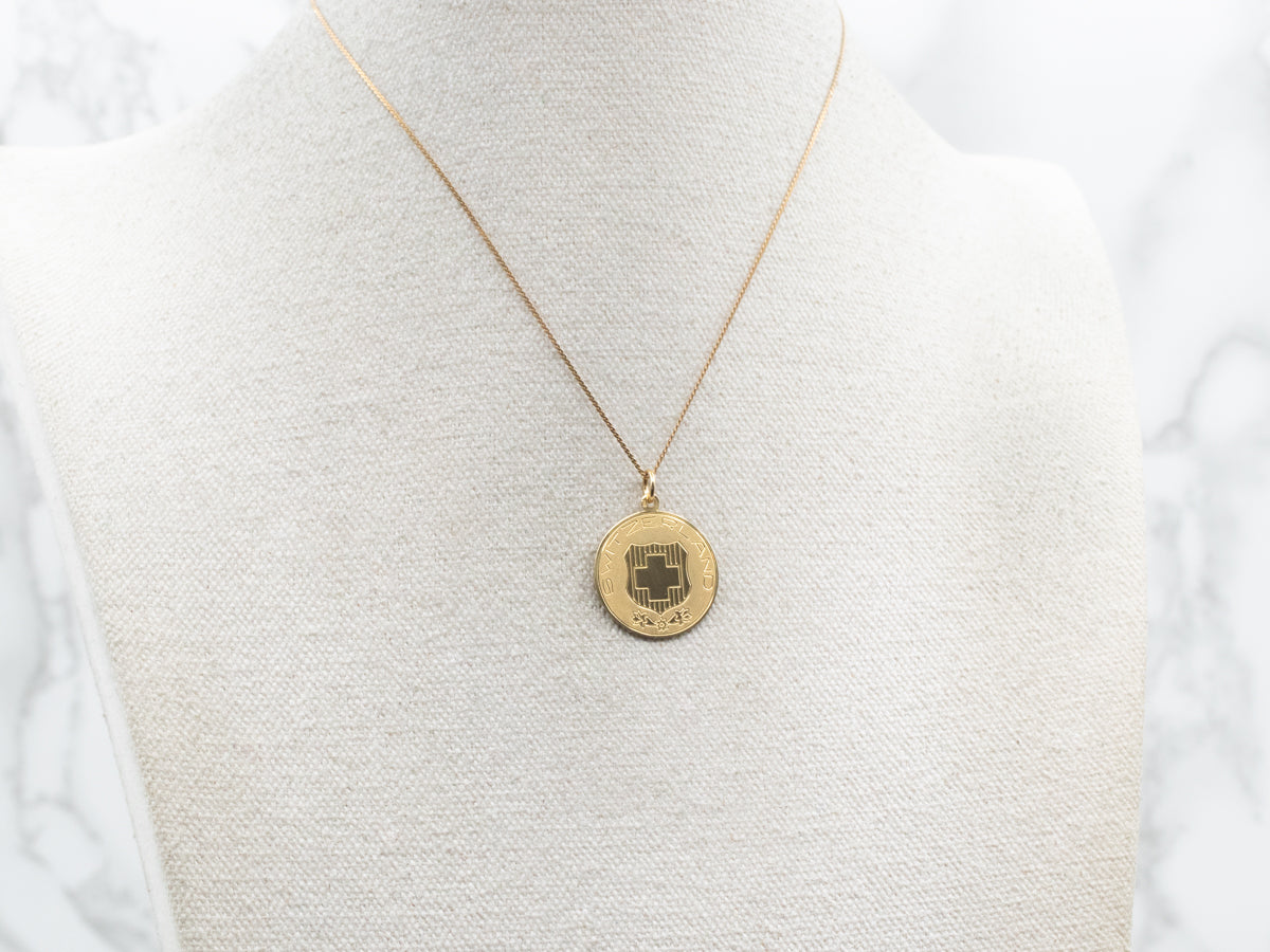 18-Karat Gold "SWITZERLAND" Disc Pendant