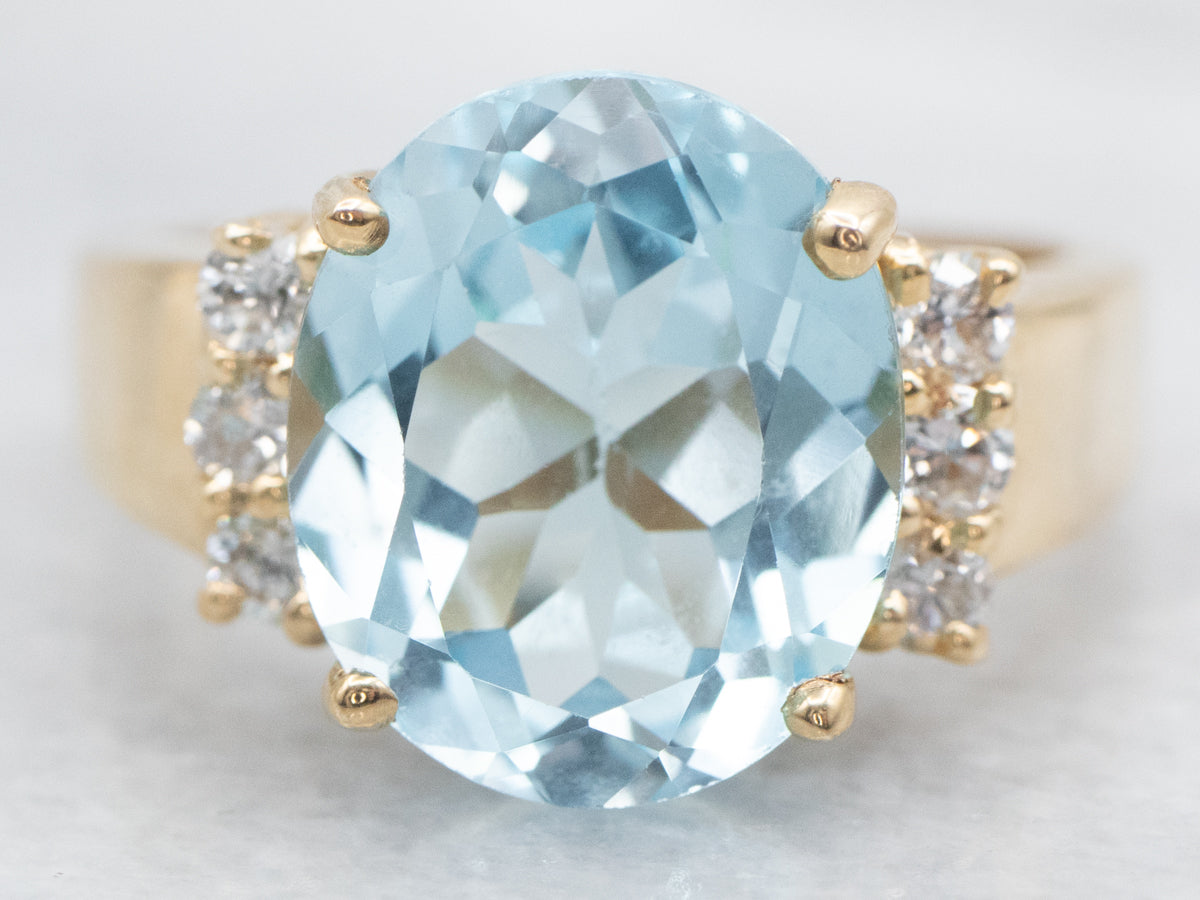 Modern Gold Blue Topaz and Diamond Ring