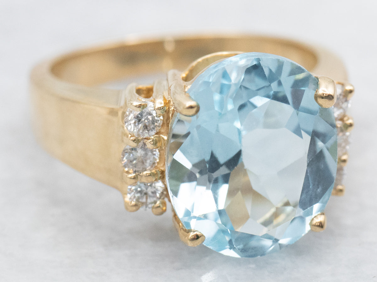 Modern Gold Blue Topaz and Diamond Ring
