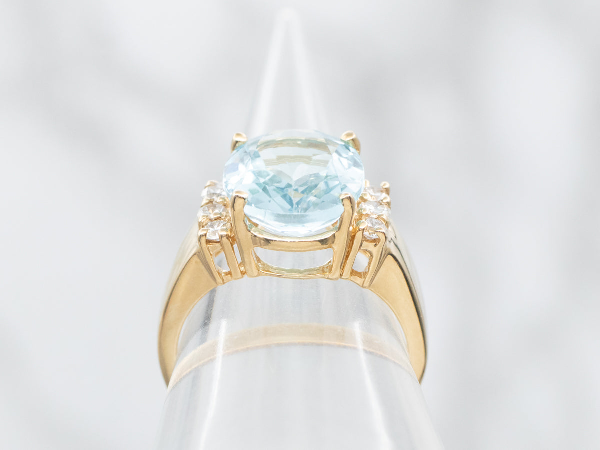 Modern Gold Blue Topaz and Diamond Ring