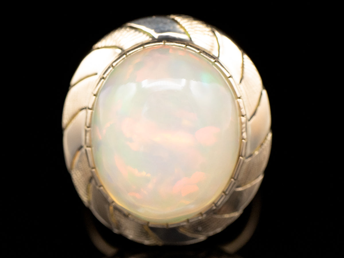 Opal Solitaire Ring with Wave Pattern Frame