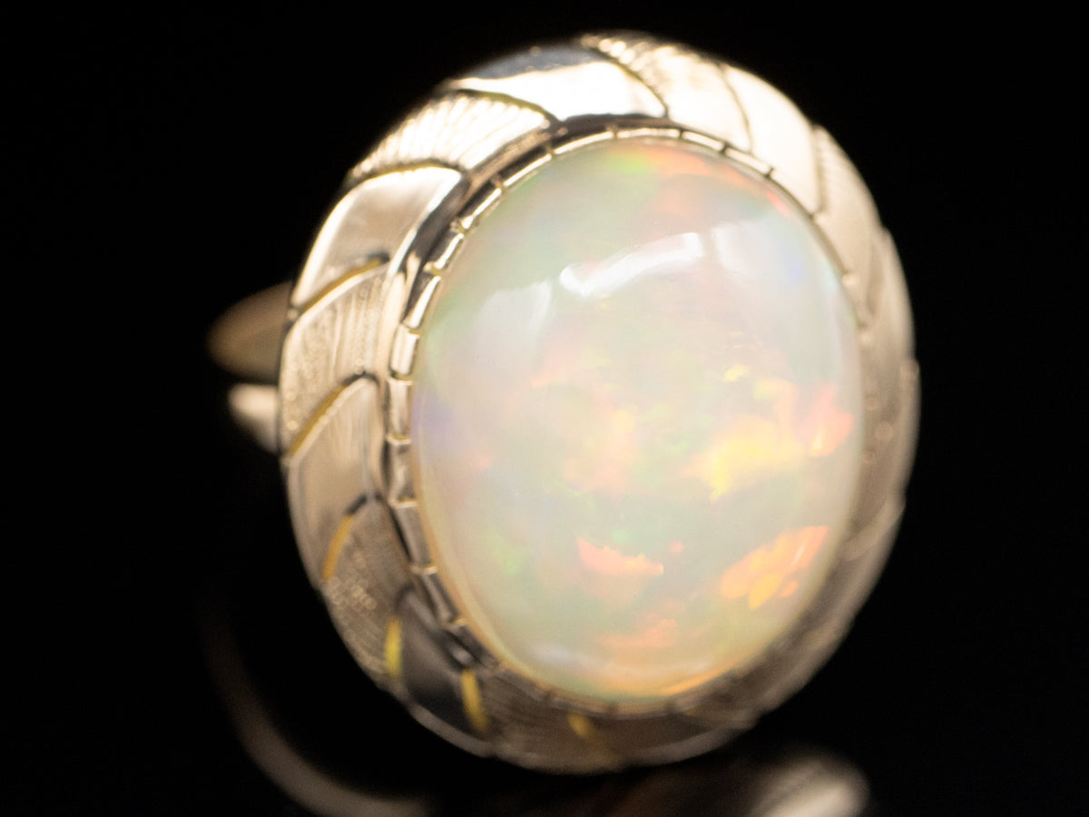 Opal Solitaire Ring with Wave Pattern Frame