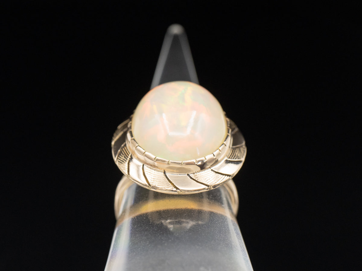 Opal Solitaire Ring with Wave Pattern Frame