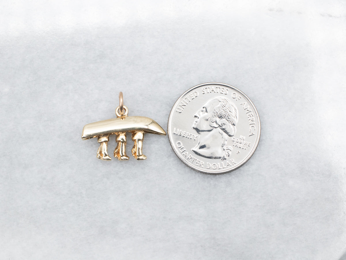 Yellow Gold Canoe Being Carried Pendant