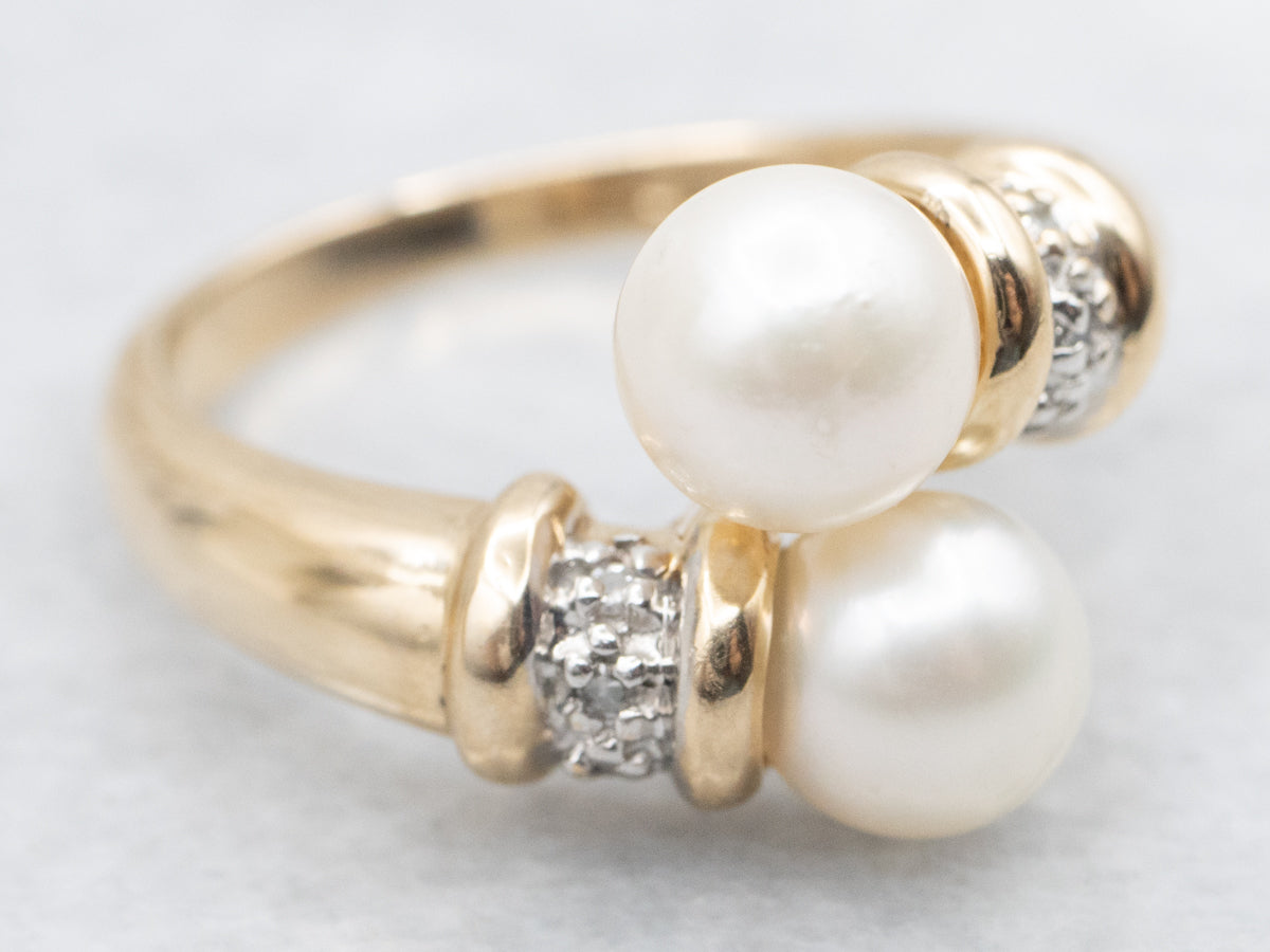 Modern Yellow Gold Pearl and Diamond Bypass Ring
